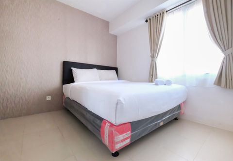 Bedroom Cozy 2BR with Mall Access at Bassura City Apartment By Travelio