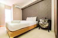 Bedroom Simple Studio Apartment at Bassura City By Travelio