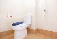 In-room Bathroom 5 Simple Studio Apartment at Bassura City By Travelio