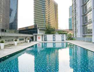 Bangunan 2 Posh 2BR Apartment at The Empyreal Condominium Epicentrum By Travelio