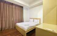 Bedroom 2 Modern 2BR Apartment at The Kensington Royal Suites By Travelio