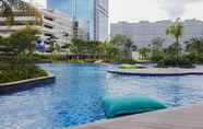 Swimming Pool 7 Modern 2BR Apartment at The Kensington Royal Suites By Travelio