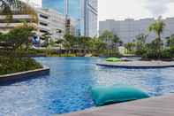 Swimming Pool Modern 2BR Apartment at The Kensington Royal Suites By Travelio