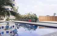 Swimming Pool 6 Comfortable 2 BR Apartment at Titanium Square By Travelio 