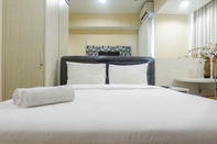 Bedroom Cozy Studio Apartment at Tamansari Papilio By Travelio