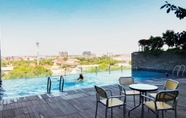 Swimming Pool 7 Cozy Studio Apartment at Tamansari Papilio By Travelio