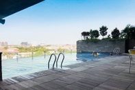 Swimming Pool Cozy Studio Apartment at Tamansari Papilio By Travelio