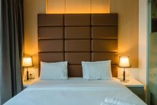 Bedroom Luxurious 1BR Apartment At Dago Suites By Travelio