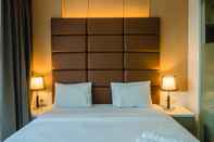 Kamar Tidur Luxurious 1BR Apartment At Dago Suites By Travelio