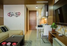 Common Space 2 Luxurious 1BR Apartment At Dago Suites By Travelio