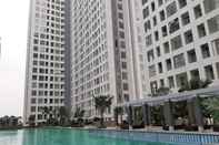 Swimming Pool Homey and Comfortable 2BR Apartment at M-Town Residence By Travelio