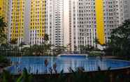 Kolam Renang 7 Cozy and Beautiful 2BR at Springlake Summarecon Bekasi Apartment By Travelio