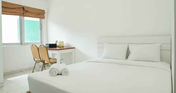 Kamar Tidur Homey and Comfy Studio Margonda Residence 1 Apartment By Travelio