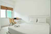 Bedroom Homey and Comfy Studio Margonda Residence 1 Apartment By Travelio