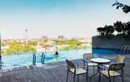Swimming Pool 5 Warm Studio at Tamansari Papilio Apartment By Travelio