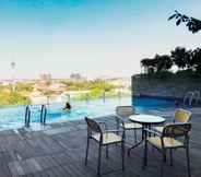 Swimming Pool 5 Warm Studio at Tamansari Papilio Apartment By Travelio
