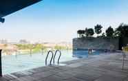 Swimming Pool 6 Warm Studio at Tamansari Papilio Apartment By Travelio