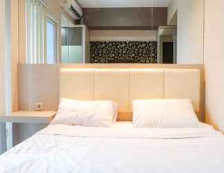 Bedroom 2 Warm Studio at Tamansari Papilio Apartment By Travelio