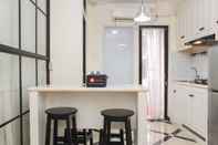 Common Space Nice and White 1BR at Bassura City Apartment By Travelio