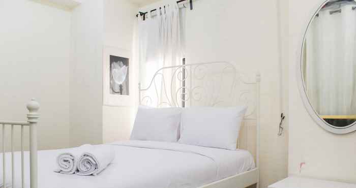 Bedroom Nice and White 1BR at Bassura City Apartment By Travelio