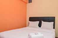 Kamar Tidur Homey and Comfort 2BR at Green Pramuka City Apartment By Travelio