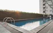 Swimming Pool 6 Warm and Nice 1BR Apartment at Belmont Residence Puri By Travelio