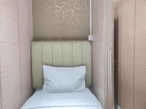 Bedroom 4 Comfort 2BR Apartment at Vida View Makassar By Travelio