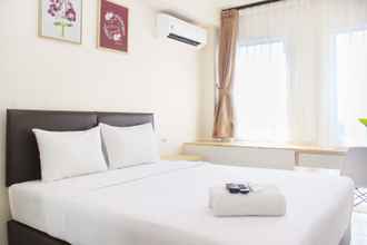 Kamar Tidur 4 Comfortable Studio Apartment near Train Station at Patraland Urbano By Travelio