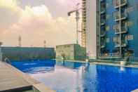 Swimming Pool Comfort 1BR Apartment at Evenciio Margonda By Travelio