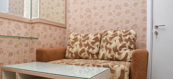 Lobby 2 Comfort Living 1BR Apartment at Green Pramuka City By Travelio