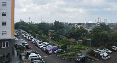 Exterior 2 Comfort Living 1BR Apartment at Green Pramuka City By Travelio