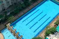 Swimming Pool Combined and Comfortable 3BR at City Park Apartment By Travelio