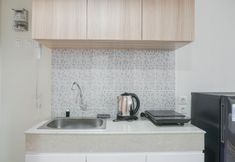 Common Space 3 Cozy and Nice Studio at Evenciio Margonda Apartment By Travelio