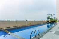 Swimming Pool Cozy and Warm Studio Apartment Margonda Residence 5 near Campus By Travelio