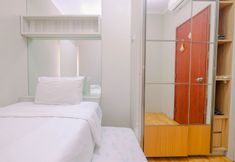 Bedroom 3 Modern 3BR Apartment at Sudirman Park By Travelio