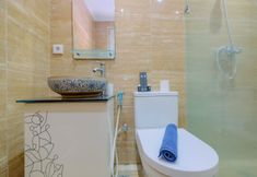 In-room Bathroom 7 Modern 3BR Apartment at Sudirman Park By Travelio