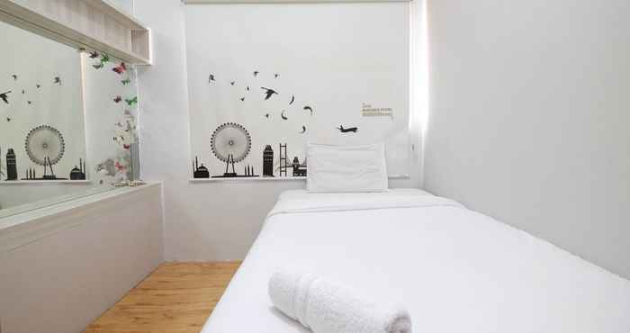 Bedroom Modern 3BR Apartment at Sudirman Park By Travelio