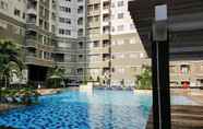 Swimming Pool 7 Relaxing 2BR Apartment at Sudirman Park By Travelio