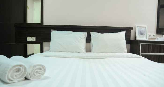 Bedroom Cozy 2BR Apartment at Sudirman Park By Travelio