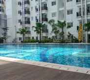 Swimming Pool 7 New and Fully Furnished 2BR Apartment at Signature Park Grande MT. Haryono By Travelio