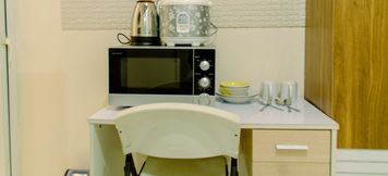 Common Space 2 Comfy Studio Apartment near Soetta at Aeropolis Residence By Travelio