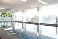Swimming Pool Cozy & Modern 2BR Apartment at Tamansari Tera Residence By Travelio