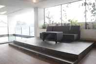 Lobby Cozy & Modern 2BR Apartment at Tamansari Tera Residence By Travelio