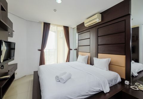 Kamar Tidur Homey and Scenic Studio Apartement at Mangga Dua Residence By Travelio