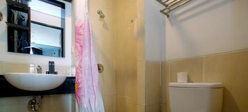 In-room Bathroom 4 Comfort and Simple Studio Apartment at Mangga Dua Residence By Travelio