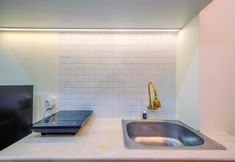 Common Space 3 Cozy and Warm Studio Evenciio Apartment Margonda near UI By Travelio