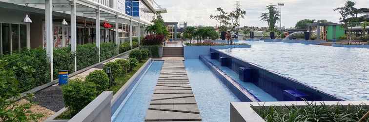 Lobi Cozy and Nice 2BR at Green Pramuka City Apartment By Travelio