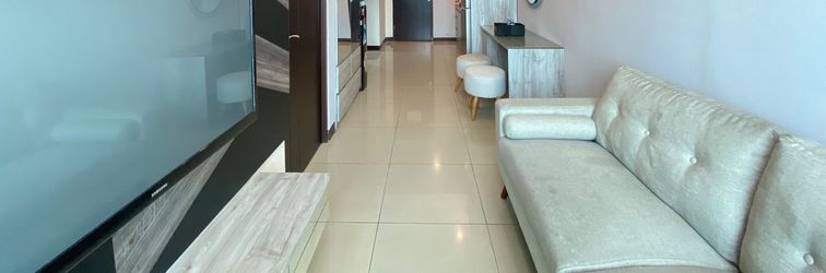 Lobby Pleasant 2BR at Tamansari La Grande Apartment By Travelio