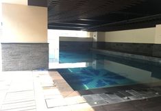 Swimming Pool 7 Pleasant 2BR at Tamansari La Grande Apartment By Travelio