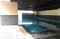 Swimming Pool Pleasant 2BR at Tamansari La Grande Apartment By Travelio